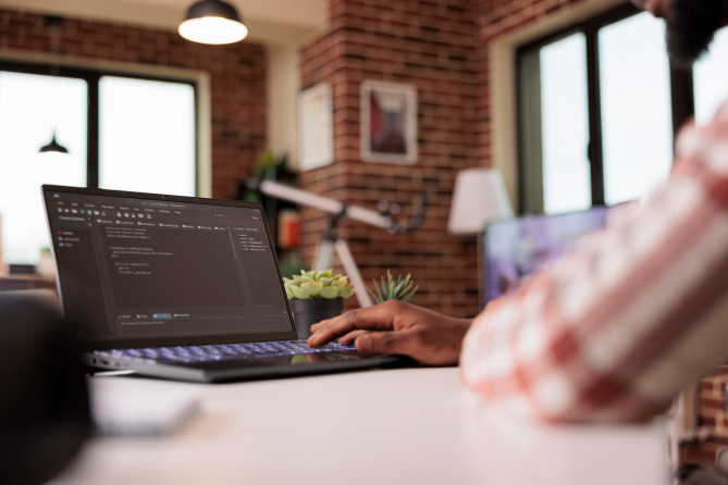 Photo: coding on a laptop.